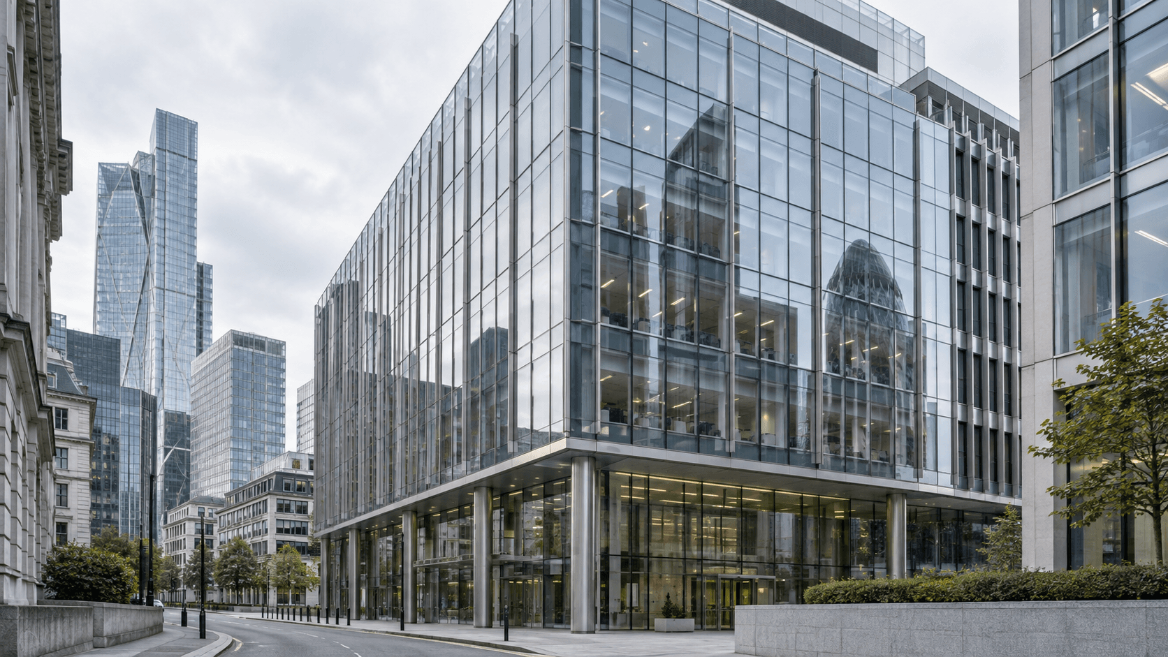 Exterior of a modern glass office building in a City of London financial district setting, representing the corporate backdrop to a wealthtech leadership change.