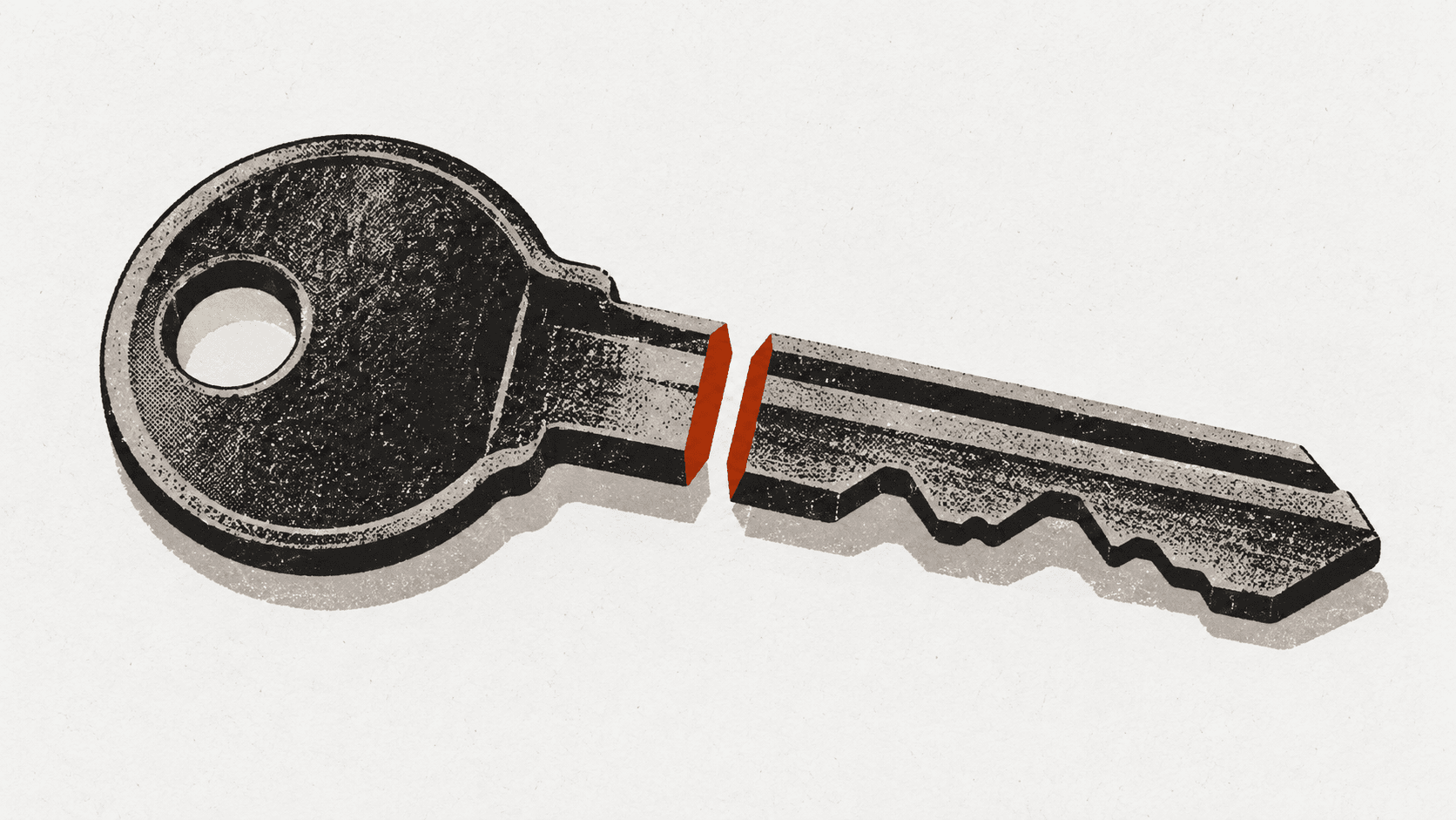 A large house key lying on a table, sliced cleanly in half with the two pieces separated but still aligned.