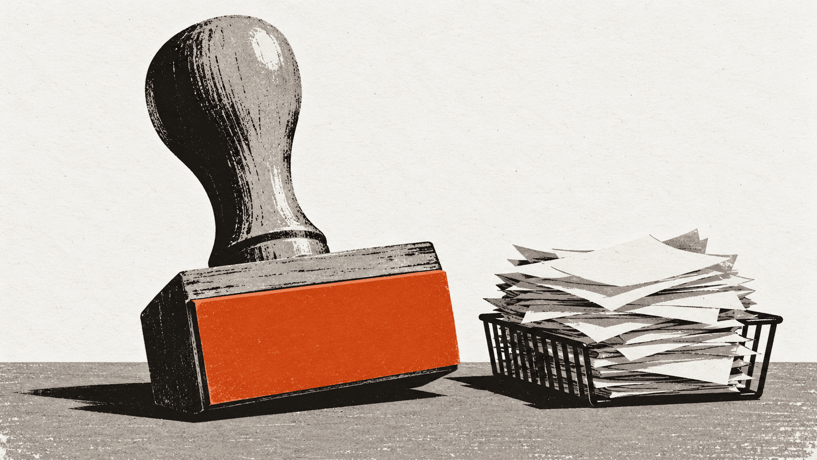 A giant rubber stamp stands on a desk next to an overflowing wire tray of invoices, its stamping face turned outward and entirely blank.