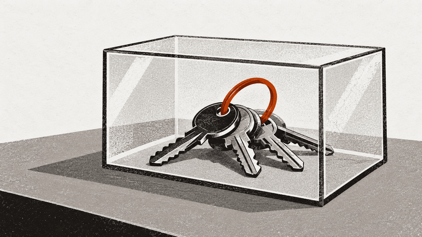 A set of house keys sealed inside a glass case on a plain desk, with no visible way to open it.