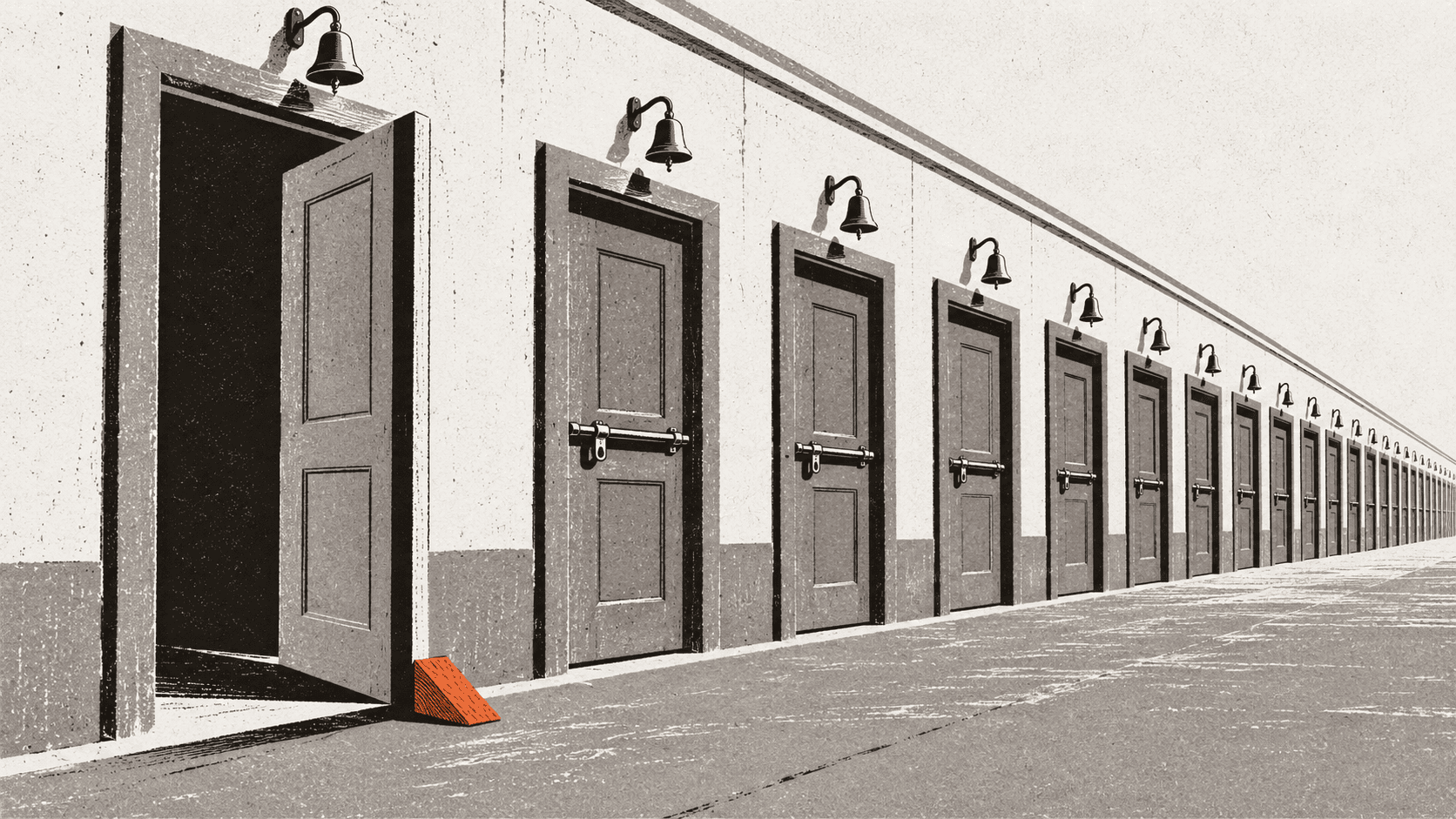 A long row of identical shut shopfront doors with one propped open by a wedge while all the others remain closed and bolted.